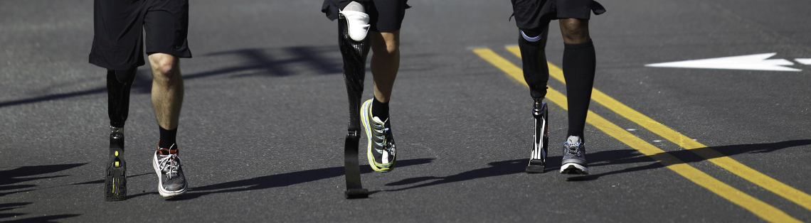 Photo of people with leg prostheses running