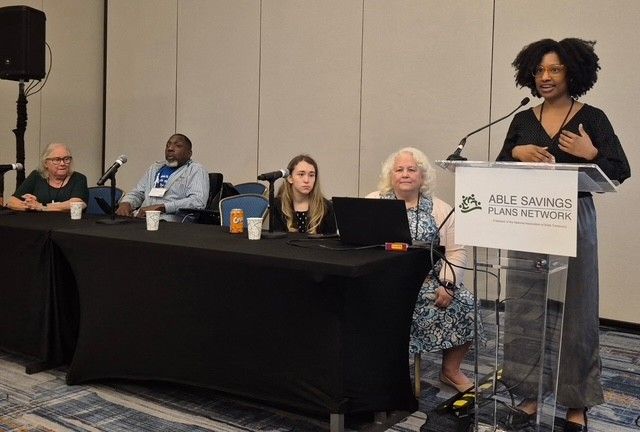 ABLE program manager at podium